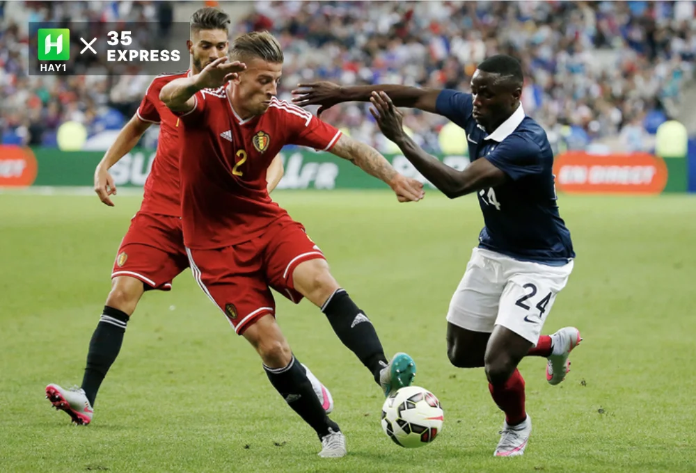 Paul Georges Ntep (phải) trong màu áo đội tuyển Pháp